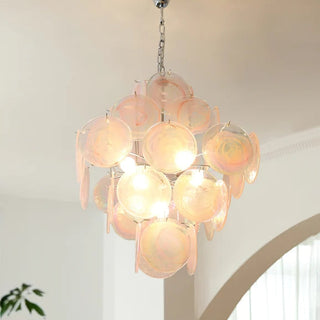 Pink Murano chandelier detail — vintage iron frame warm texture
