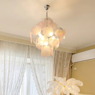 Pink Murano chandelier illuminated — vintage iron frame warm pendant