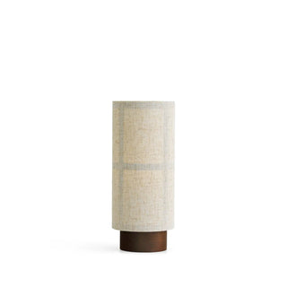 Natural fiber cylinder lamp front — warm ambient light