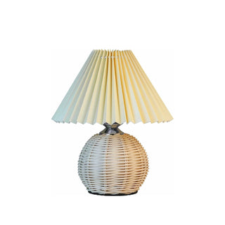 Bamboo designer lamp side angle — hand-woven pleated shade warm glow