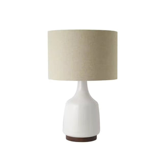 Ceramic cove table lamp — handcrafted elegant side angle