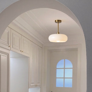 Vintage amber ceiling lamp close-up, round glass pendant