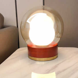 Contemporary round wood lamp close-up — metal glass detail