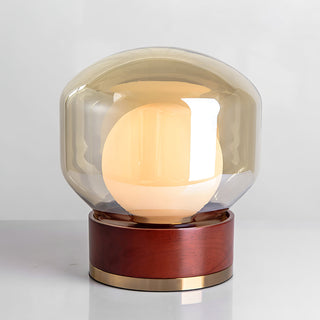 Sleek contemporary glass lamp — round metal wood warm