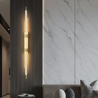 Slim brass wall lamp illuminated — Katana modern sconce