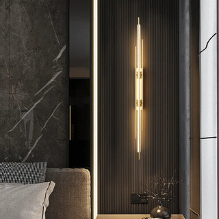 Katana brass wall light close-up — contemporary slim LED fixture
