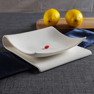 folded ceramic plate earthworks handcrafted porcelain serving dish luxury dining dishwasher safe side view