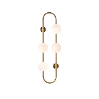 Brass metal capsule wall sconce illuminated — Scandinavian lamp