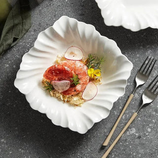 ceramic bowl earthworks handcrafted porcelain tableware folded shell design dishwasher safe close-up
