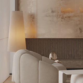 Modern ivory floor lamp illuminated — warm cozy ambient