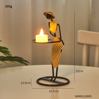 Vintage iron humanoid candle stand — elegant tea light holder