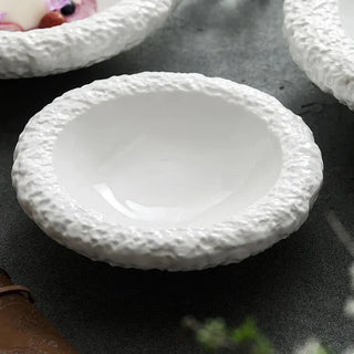 ceramic plate collection earthworks handcrafted porcelain dinnerware textured edges detail