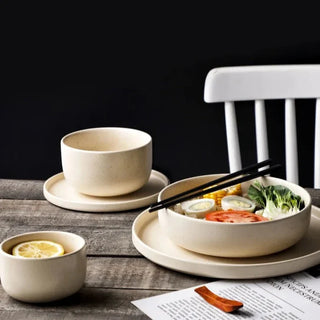 matte ceramic dinnerware earthworks frosted porcelain plates handcrafted bowls set lifestyle view