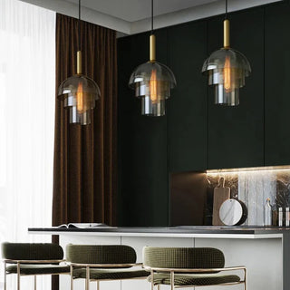 Salt pendant lamp illuminated — warm amber cognac glass glow