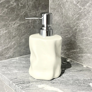 handcrafted ceramic lotion dispenser bathroom detail