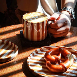 ceramic mug toscana collection hand painted orange striped cup angle view