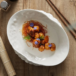 rock shell ceramic plate earthworks handcrafted luxury dining plate dishwasher safe angle view