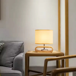 Classic designer lamp linen shade — wooden base side angle