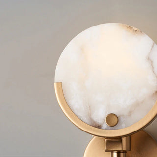 Marble and brass wall lamp detail — Nordic interior lighting