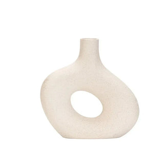 beige ceramic vase handcrafted porcelain vase modern minimalist home accent close-up