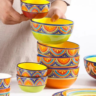 hand-painted ceramic dinnerware earthworks artisan crafted porcelain plates bowls set angle view