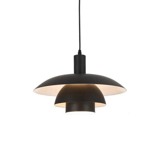 Modern layered shell pendant light illuminating a contemporary dining area