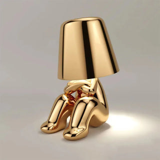 Golden resin lamp illuminated — designer warm ambient glow