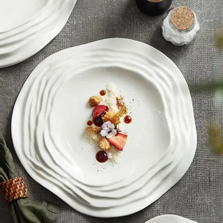 white ceramic plate earthworks handcrafted porcelain plates unique wave design side view