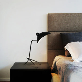 Metal insect design lamp front — handcrafted angular detail