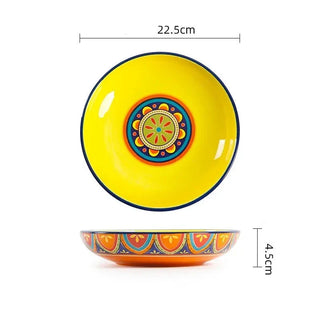hand-painted ceramic dinnerware earthworks artisan crafted porcelain plates bowls set detail shot