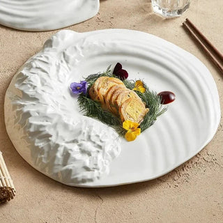 ceramic plate earthworks handcrafted porcelain rocky texture luxury dinnerware close-up