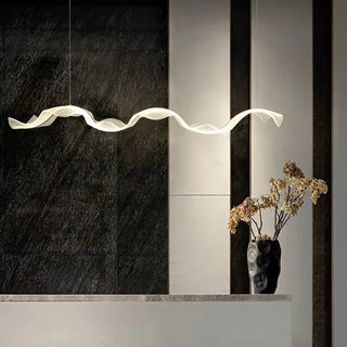 Metal ribbon pendant light close-up — modern sculptural ceiling fixture