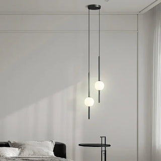 Nordic pendant light close-up — smoked black glass ball with white shade