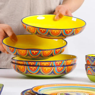 hand-painted ceramic dinnerware earthworks artisan crafted porcelain plates bowls set lifestyle view