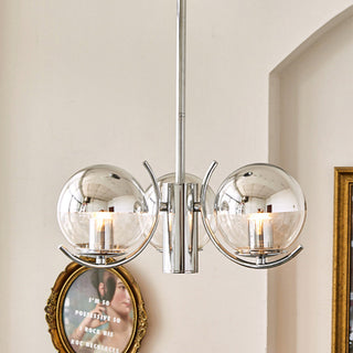 Modern silver glass chandelier detail — metal frame space warm texture