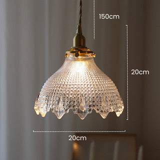 Mid-century brass glass pendant hanging in vintage interior