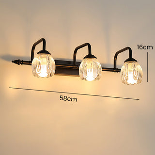 Black glass vanity wall sconce iron frame detail — bathroom lamp