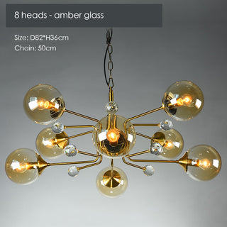 Modern gold LED chandelier illuminated — glass contemporary warm