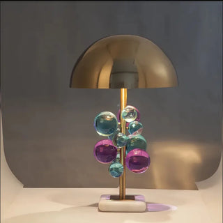 Floral brass dome lamp side — white marble warm glow