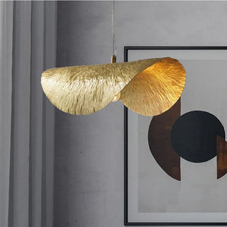 Copper leaf pendant over dining table — luxury artisan ceiling lamp