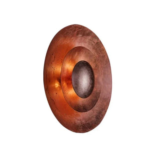 Dimmable rose gold wall light illuminated — handcrafted metal sconce
