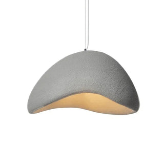 Organic resin pendant lamp glowing — Mediterranean-inspired ceiling light