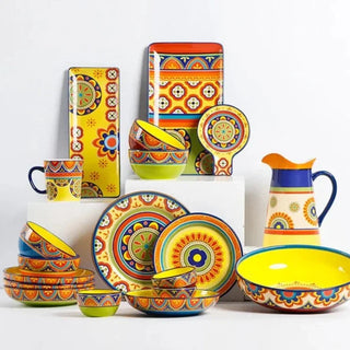 hand-painted ceramic dinnerware earthworks artisan crafted porcelain plates bowls set side view