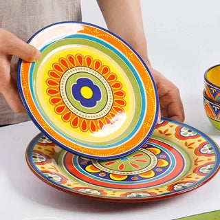 hand-painted ceramic dinnerware earthworks artisan crafted porcelain plates bowls set close-up