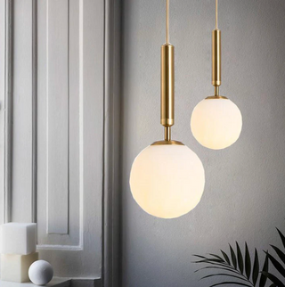 Frosted glass globe pendant with brass fitting — contemporary dining ceiling lamp