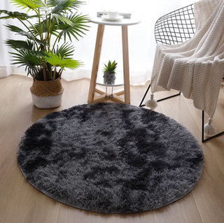 round dark grey kilim style polyester floor area rug close-up