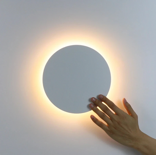 Modern round wall sconce with touch activation — LED ambient light