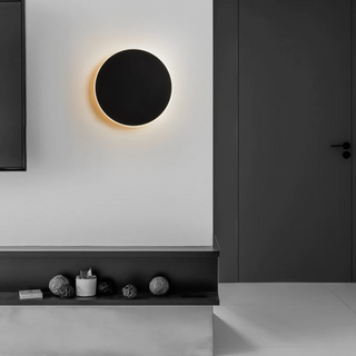 Circular black acrylic wall sconce illuminated — touch switch LED