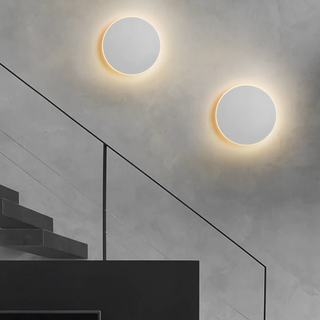 Circular metal wall lamp detail — touch switch LED interior fixture