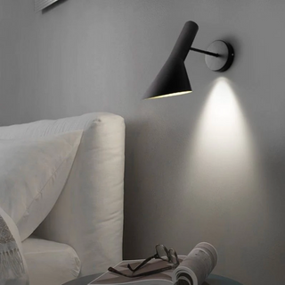 Italian design wall sconce detail — matte black LED luxury fixture